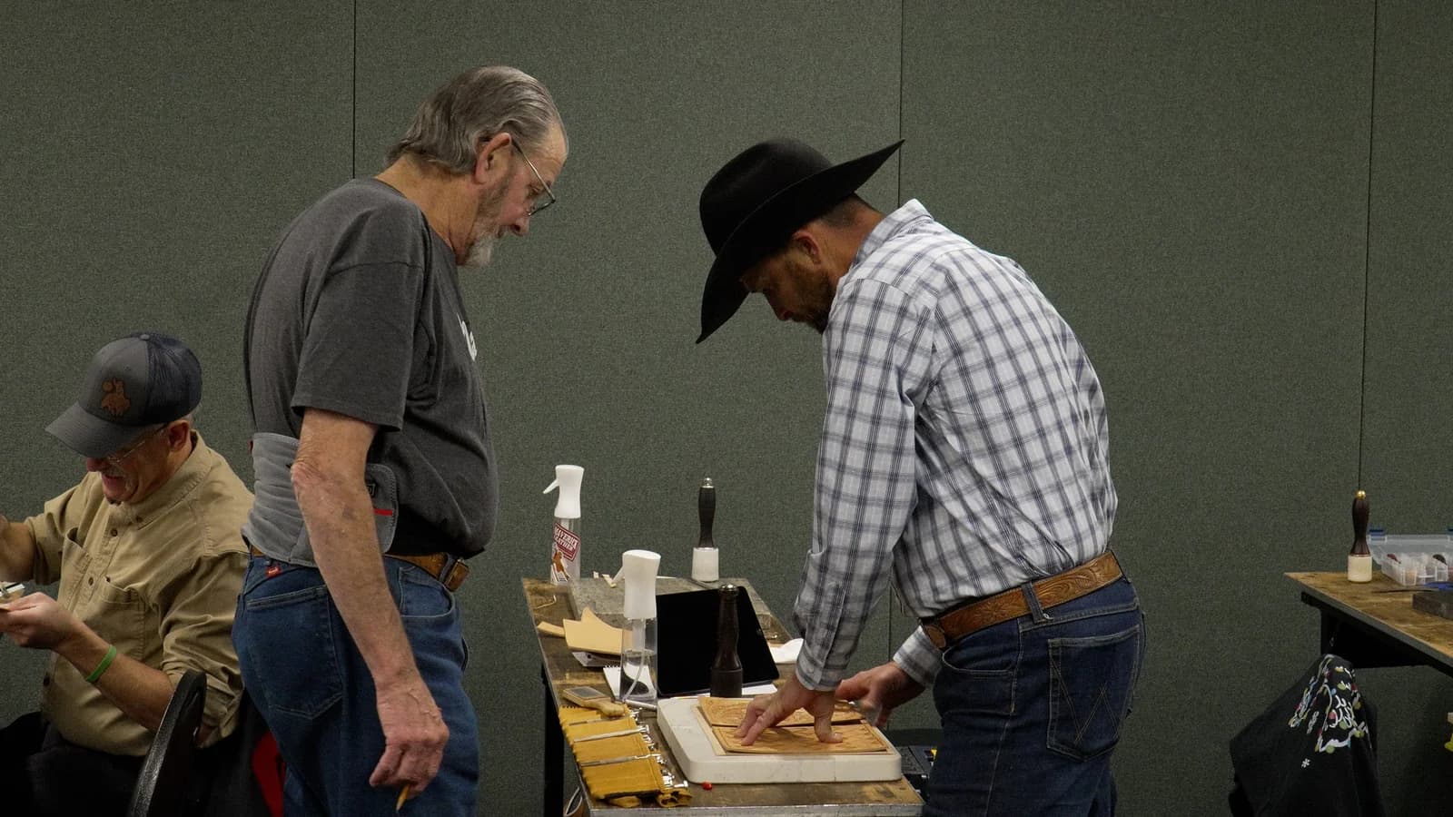 Leatherworkers participating in a workshop demonstration
