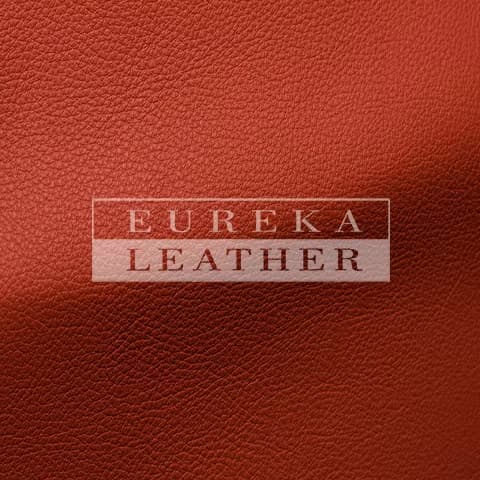 Eureka Leather name over a close view of red leather grain