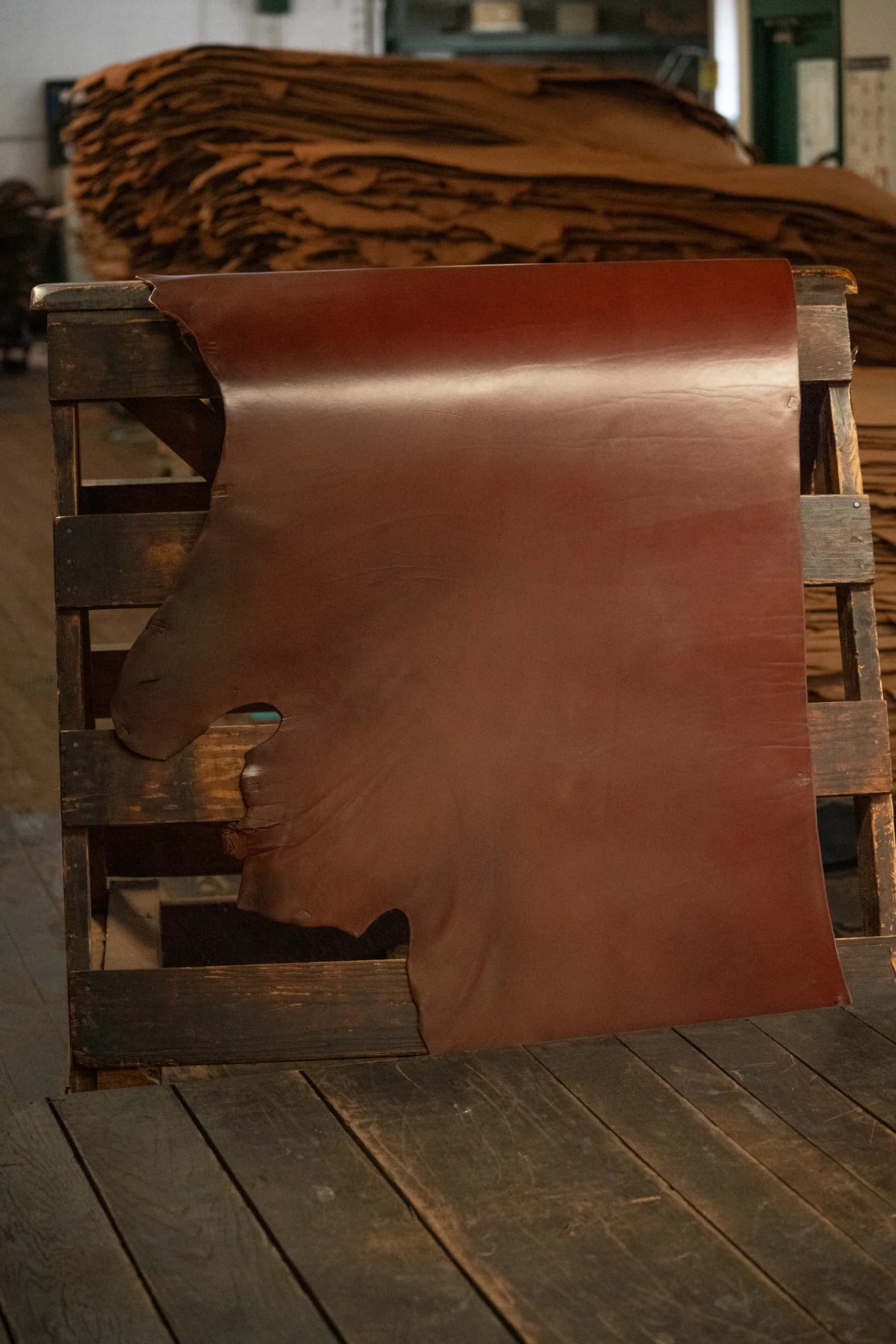 British Brown Hermann Oak English Bridle leather displayed on a wooden rack