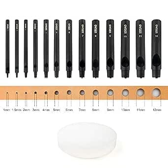 Thirteen black OWDEN hollow punches in graduated metric sizes with round nylon cutting mat